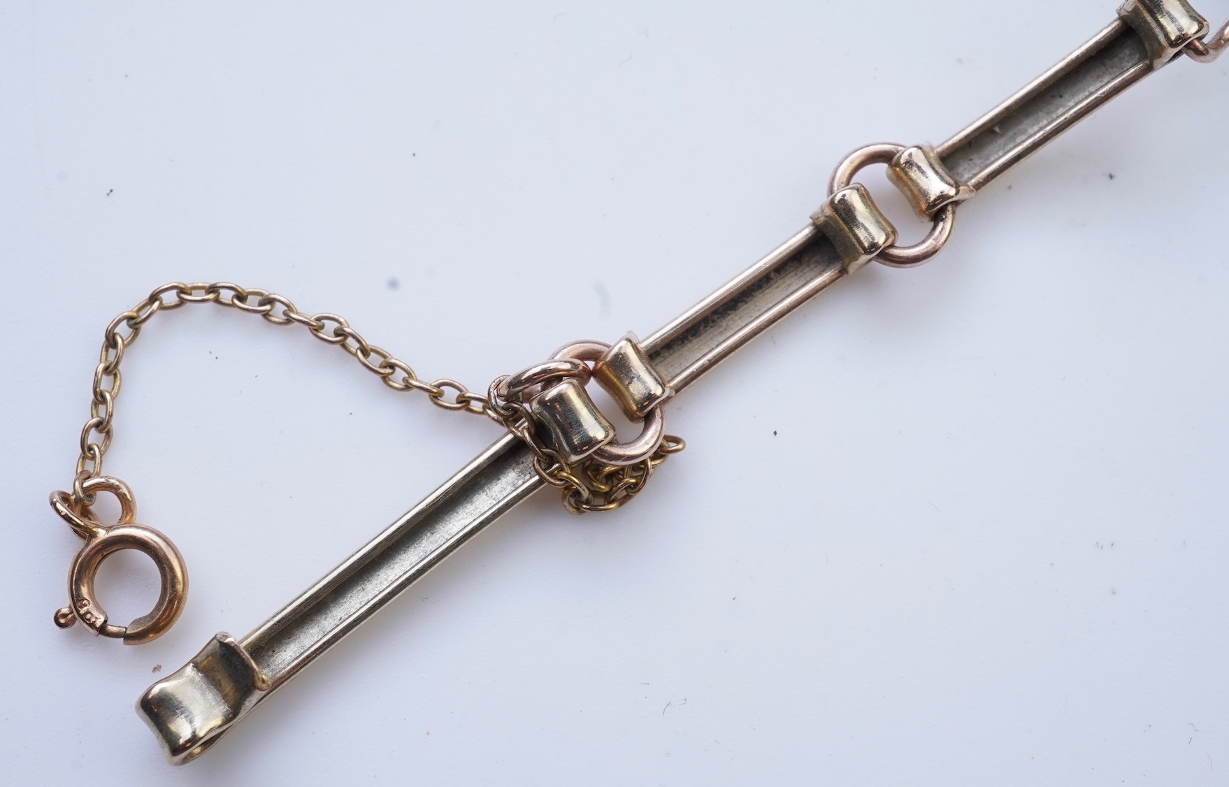 An opal triplet bracelet and pair of earrings, comprising: a gold bracelet set with opal triplets, length 18cm; and a pair of studs set with opal doublets, mounted in gold, length 0.8cm each, post fittings, stamped 585,